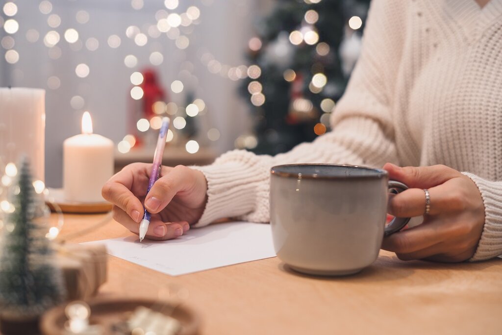 Woman making a Christmas list