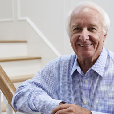 Man smiling on stairs