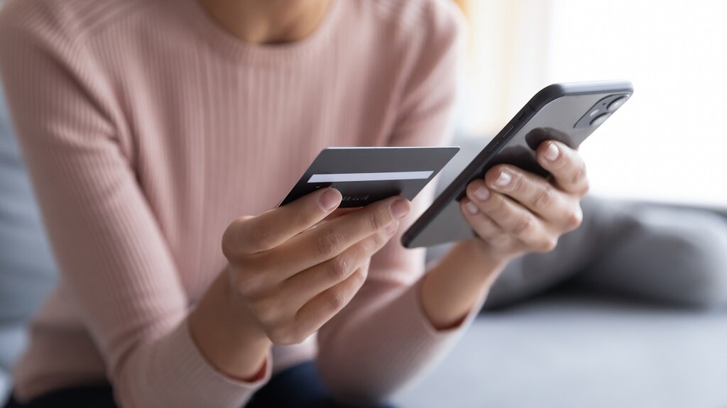 Woman holding credit card