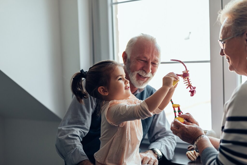 Grandparents playing with grandchild