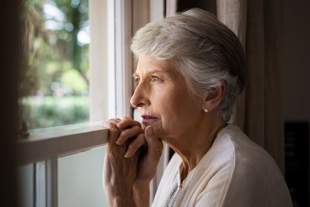 Lady looking out of a window