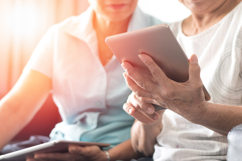 Couple working on Ipad