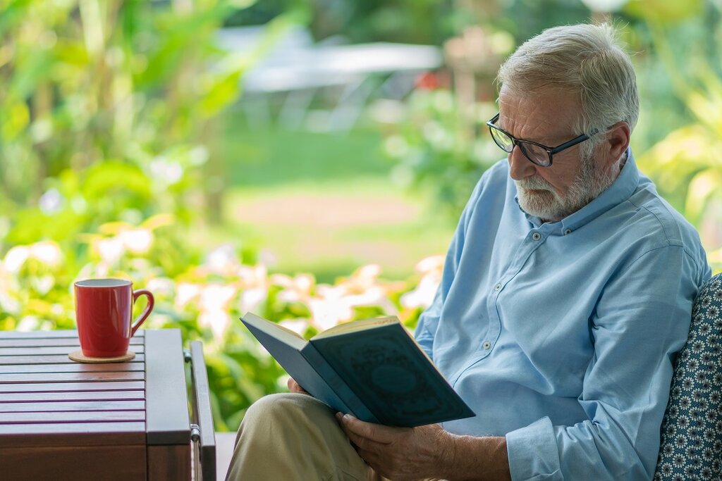 Older man reading book