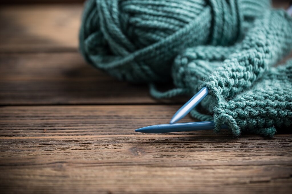 Needles and yarn on a table