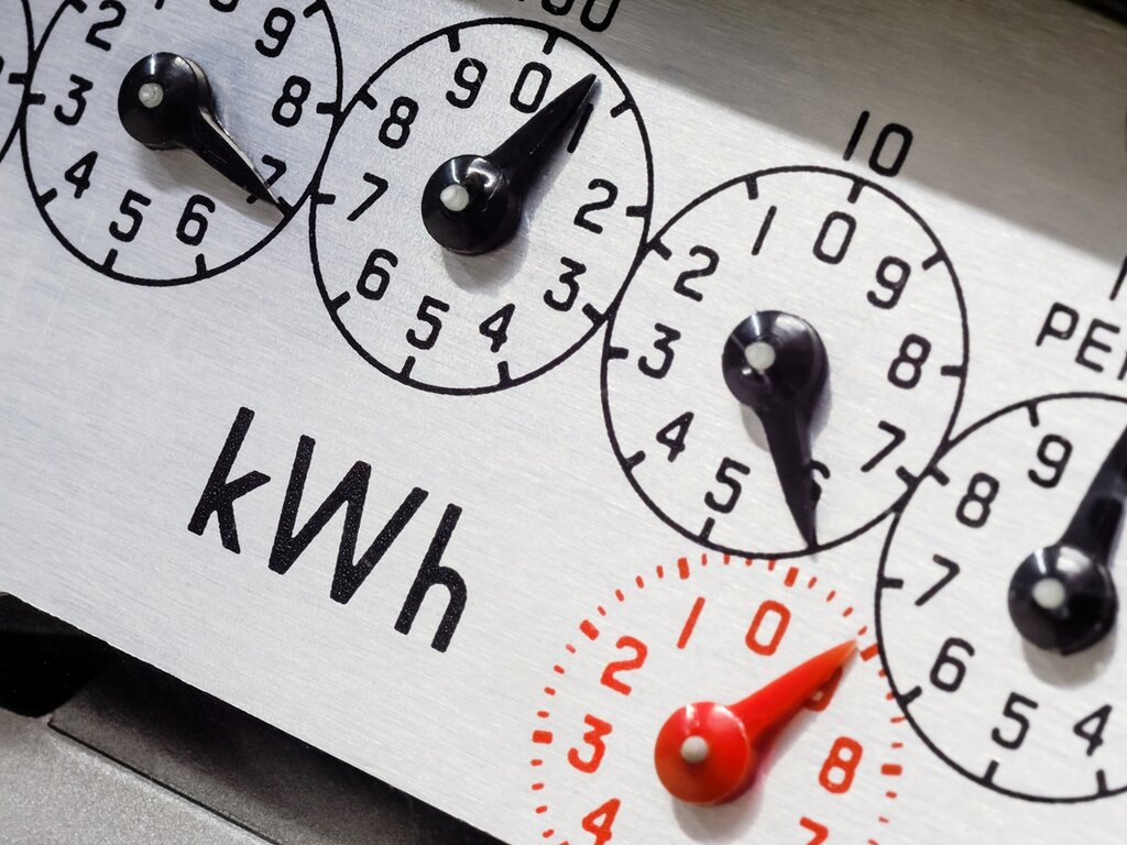 A close-up of an electricity metre dial