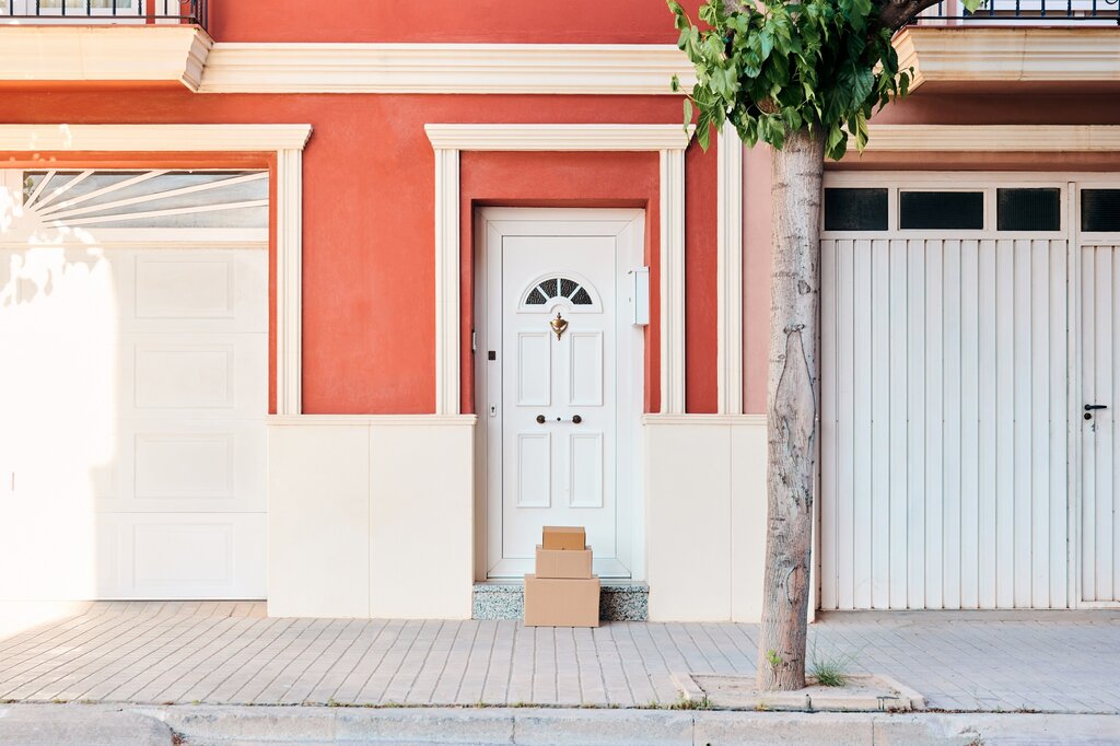 Packages outside a home painted orange