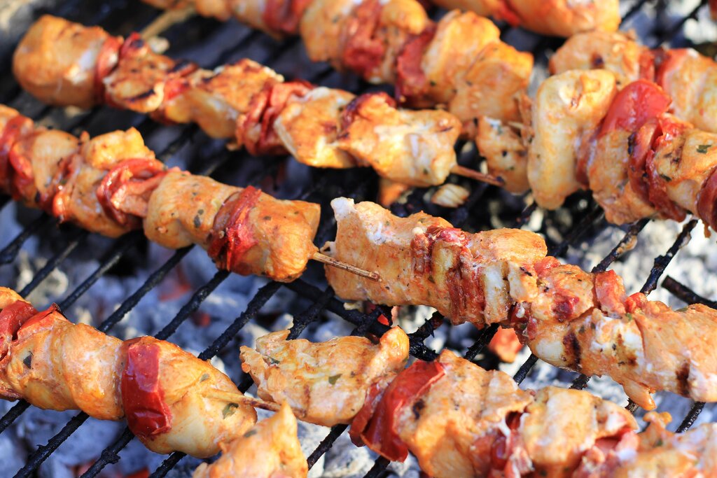 Chicken and chorizo kebabs on a barbeque