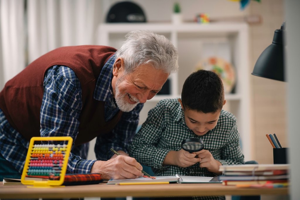 granddad working with grandson