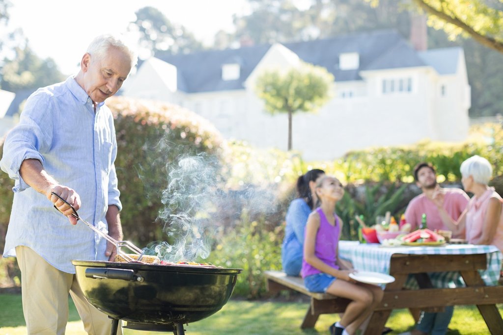 older man grilling BBQ