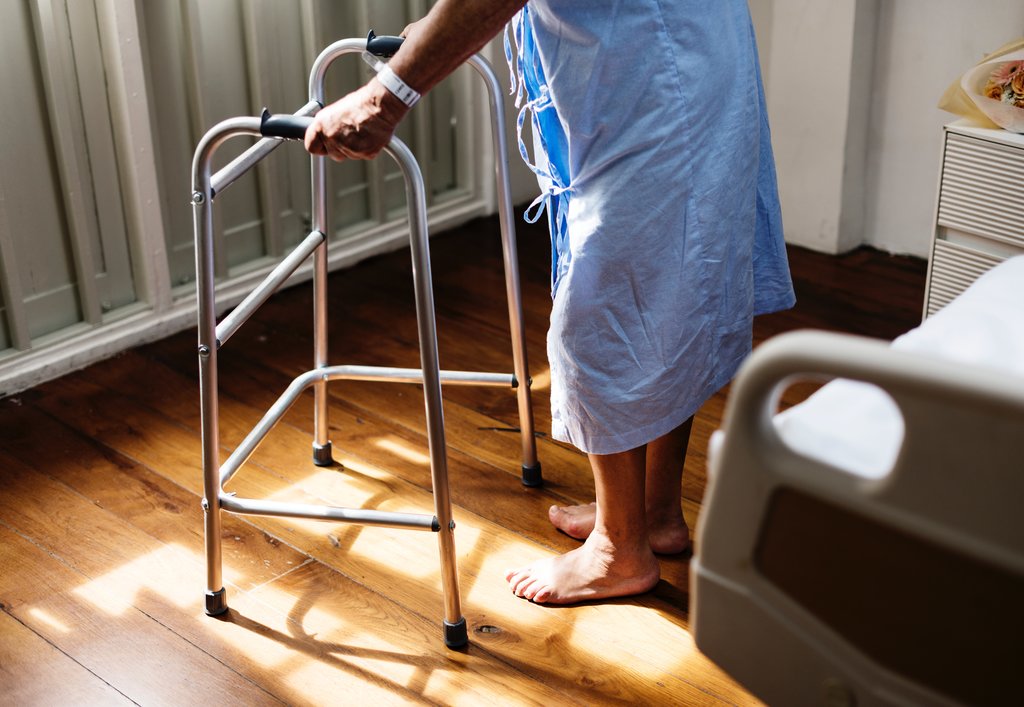 A woman using a walking frame