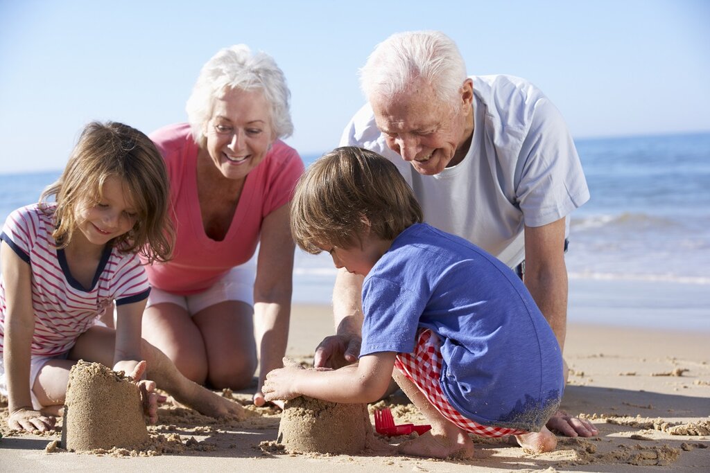 Grandparents and grandchildren on beach