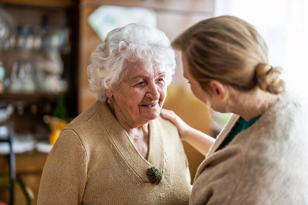 Woman with dementia being cared for