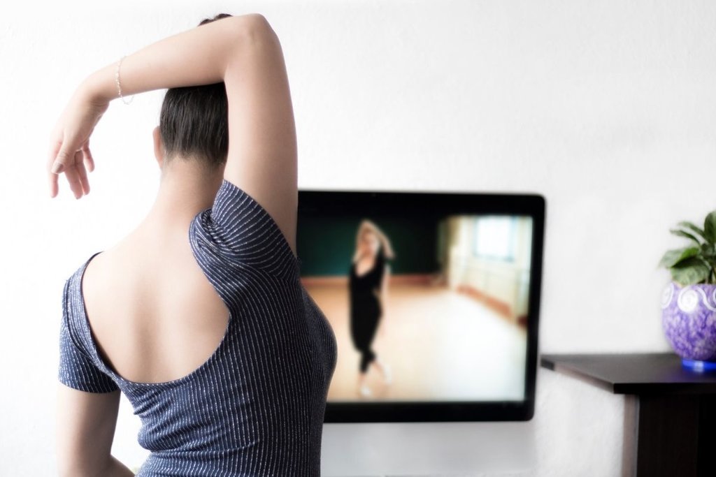 Woman doing online dance class