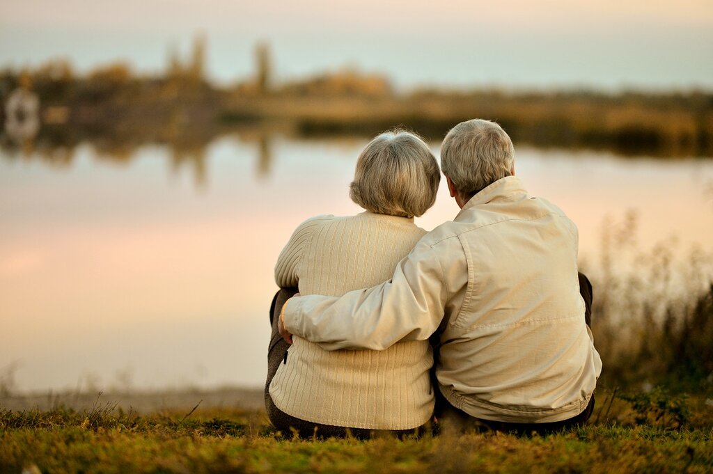 Elderly couple by lake