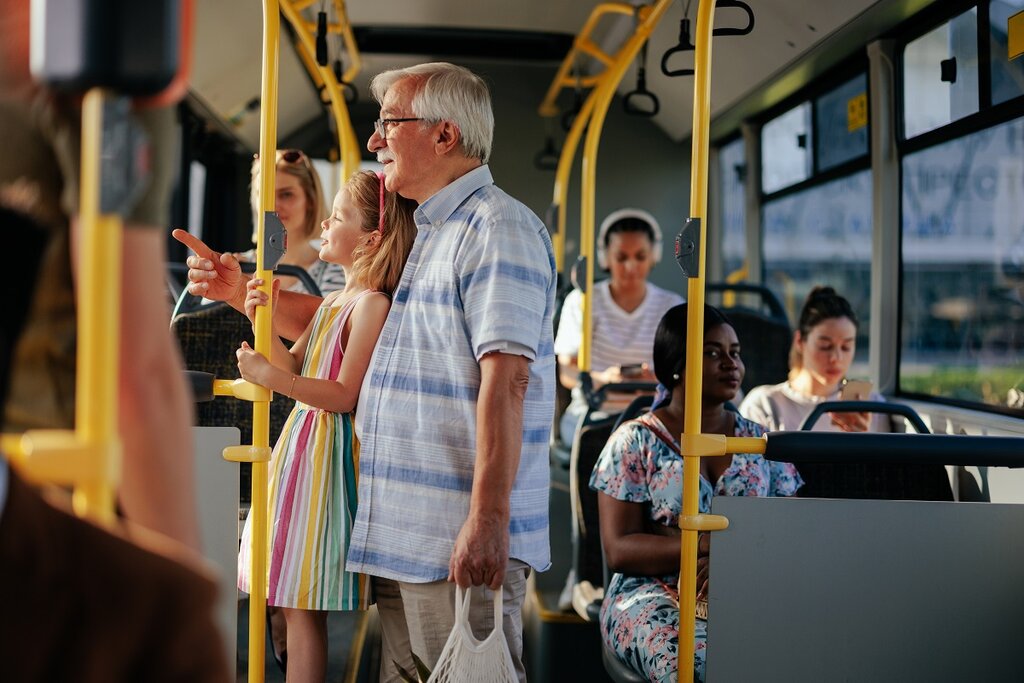 Grandad and grandaughter on bus