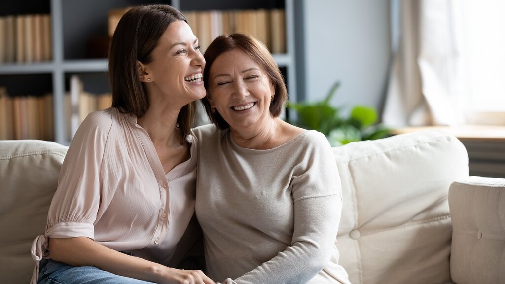 Daughter and mother on sofa