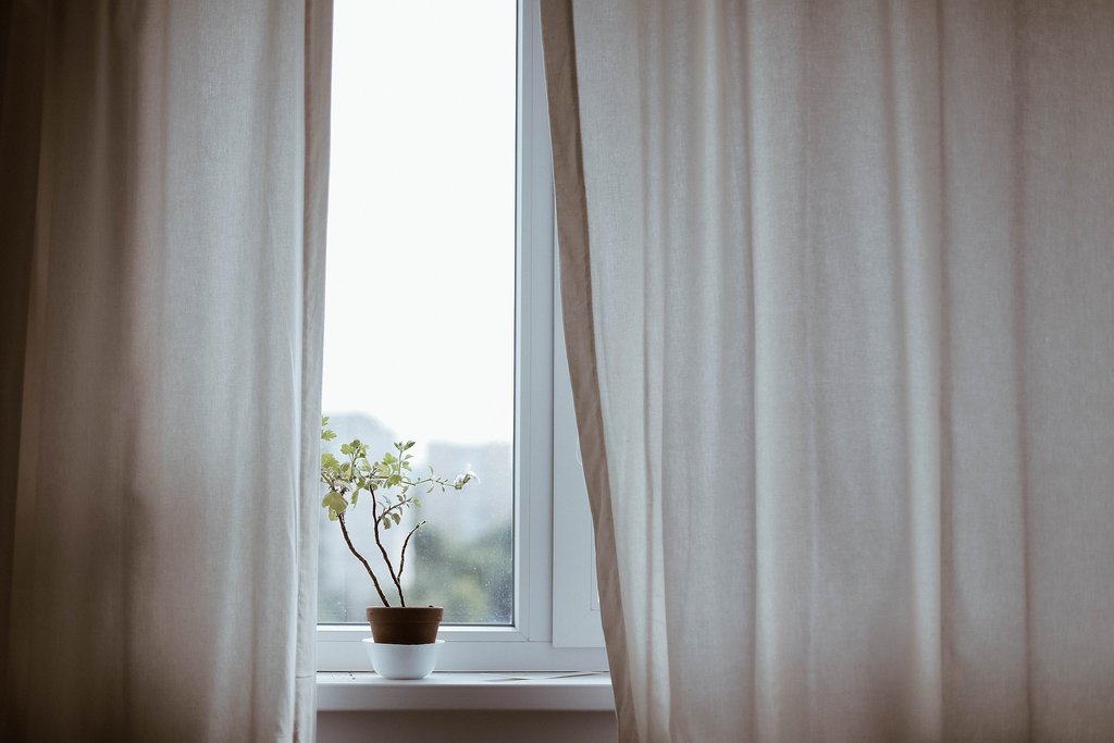 Use thick curtains or blinds to stay warm