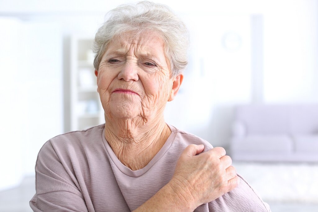 Woman with painful shoulder