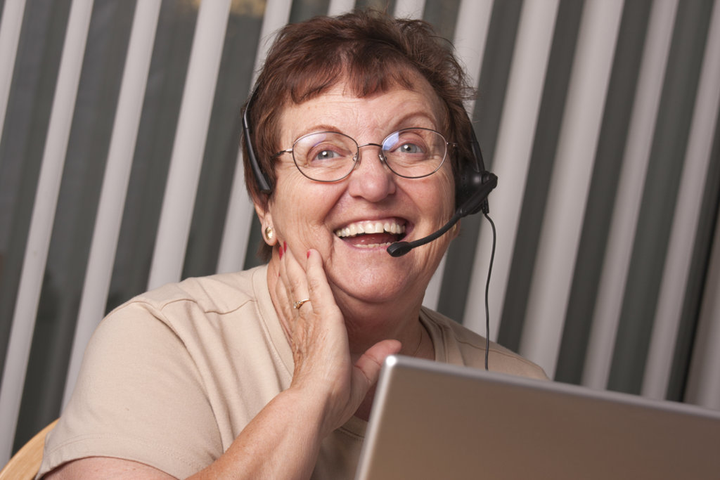 Mature volunteer wearing headset