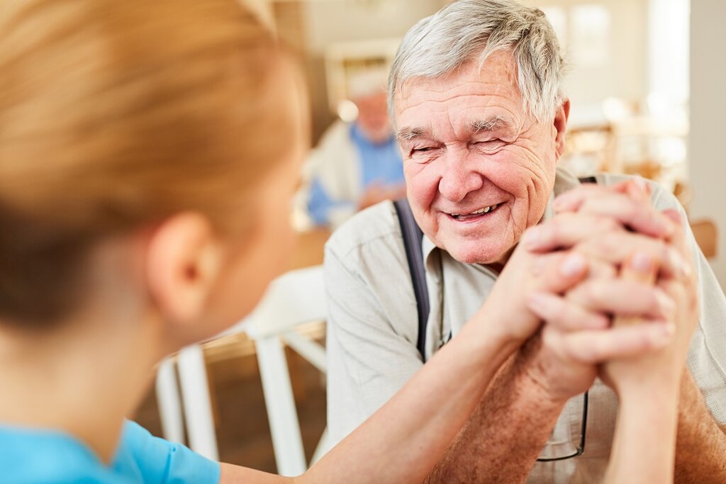 Carer and elderly man