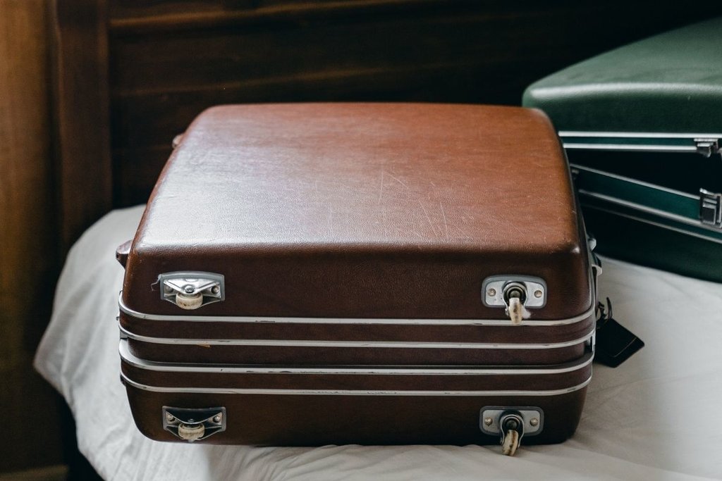 Packed suitcases on bed